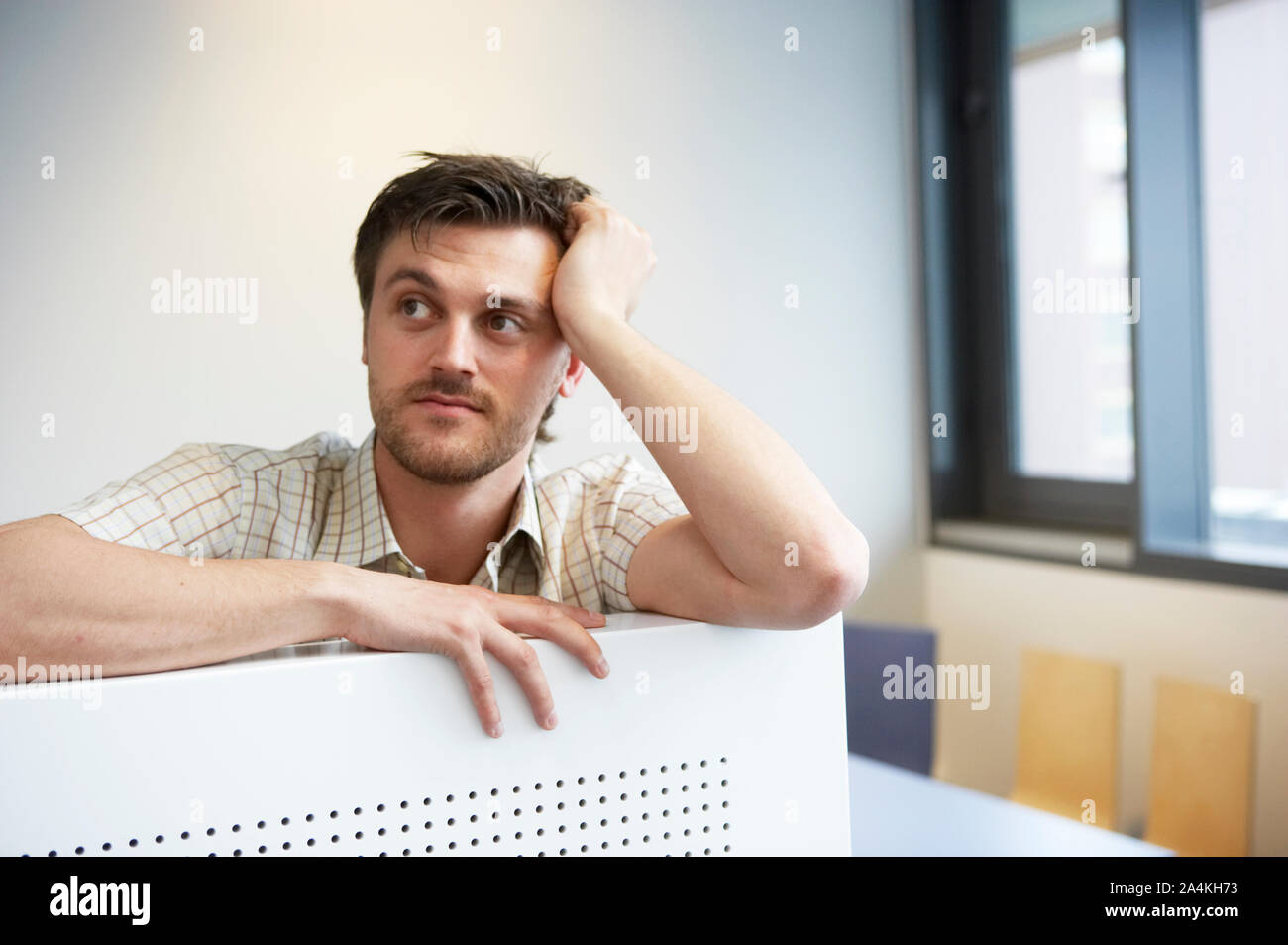 Young man in workplace Stock Photo