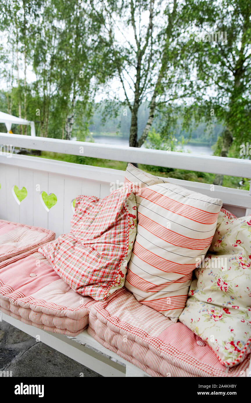 Bench with pillows Stock Photo Alamy