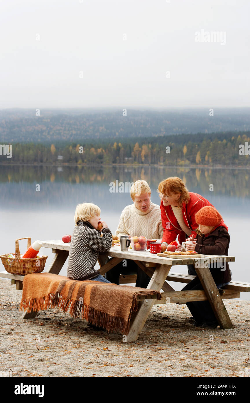 Family by lake in Norway Stock Photo