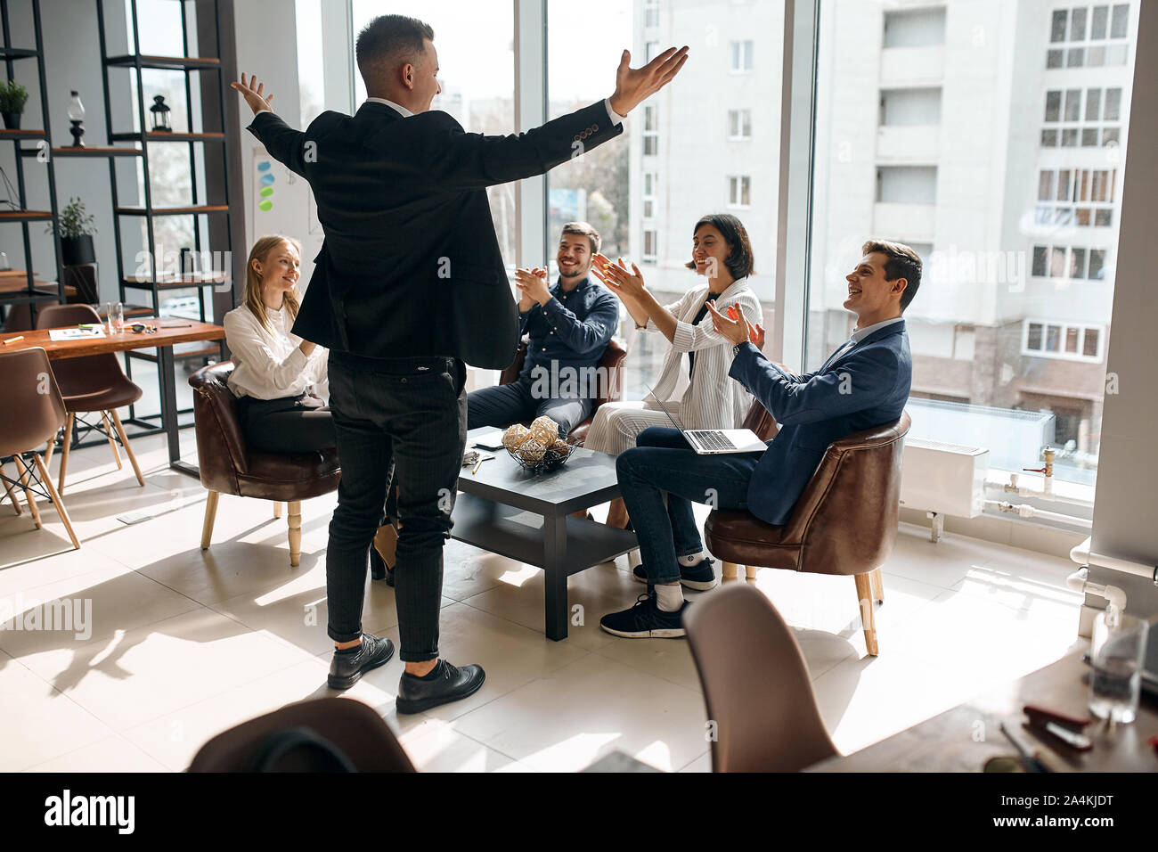 Photo of successful businessman raising his arms expressing positive ...