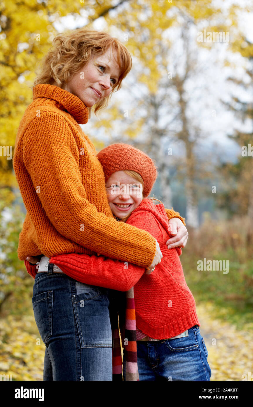 Mother and daughter hugging Stock Photo