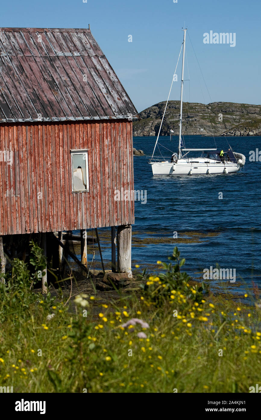 Boathouse and sailboat Stock Photo