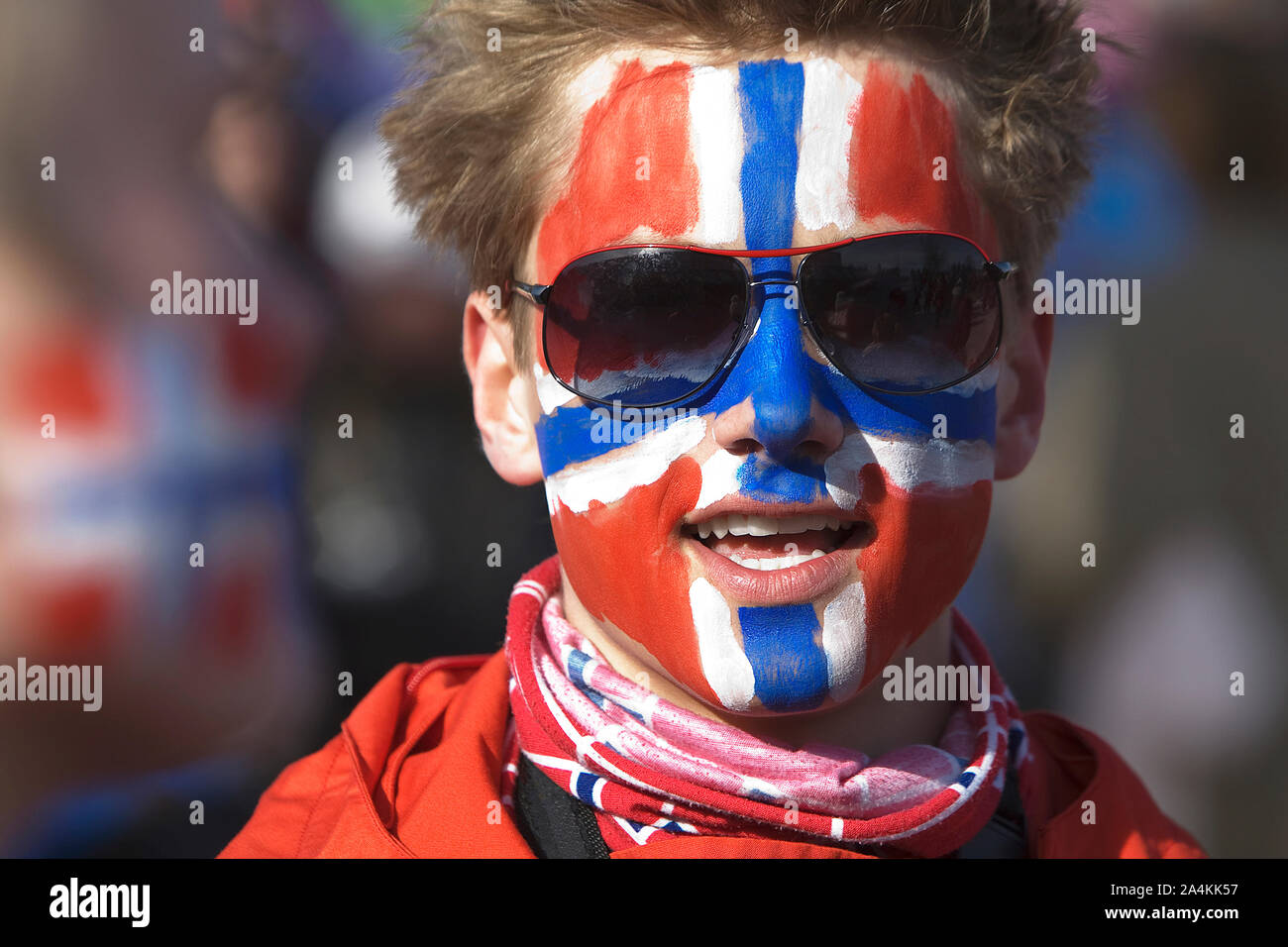 Norwegian Flag Painted On Man's Face Stock Photo