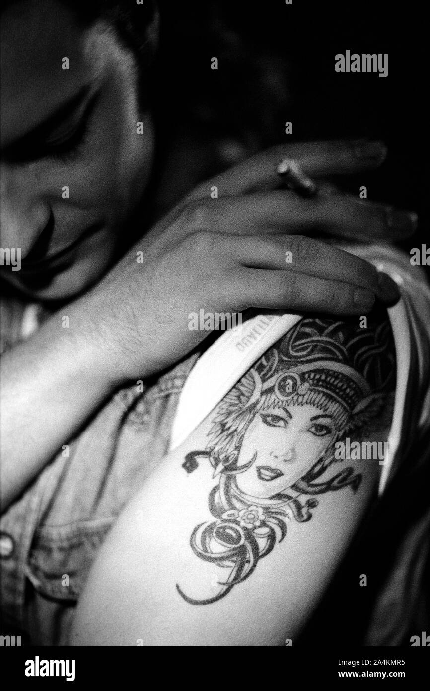 Man with tattoos smoking hi-res stock photography and images - Alamy