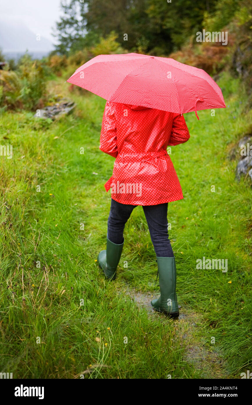 Woman with red umbrella Stock Photo