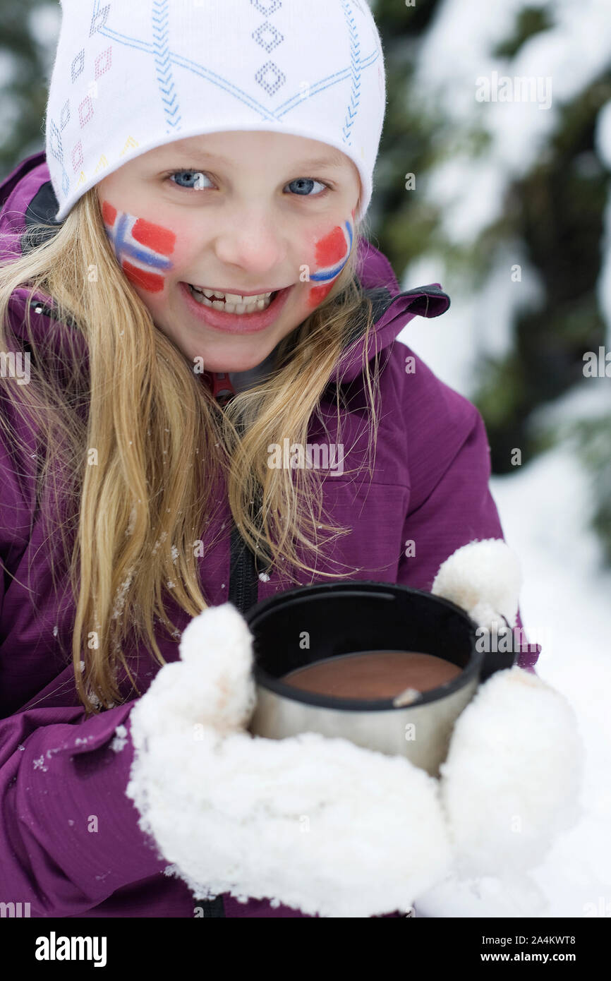 Girl Holding Mug At Nordic World Ski Championships, Norway Stock Photo