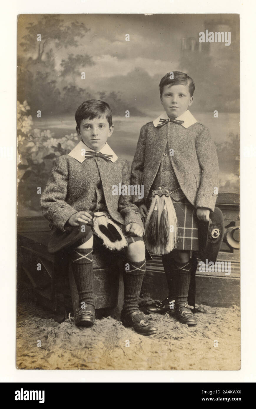 Early 1900's post Edwardian studio portrait of young brothers, William Purdie aged 8 years, Thomas Purdie aged 5,  wearing sporrans, dated 29 June 1912, Hamilton, Lanarkshire, Scotland, U.K. Stock Photo