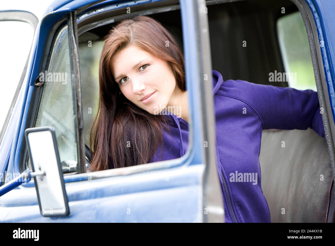 Portrait Of Women Sitting In Car, Outdoors Stock Photo