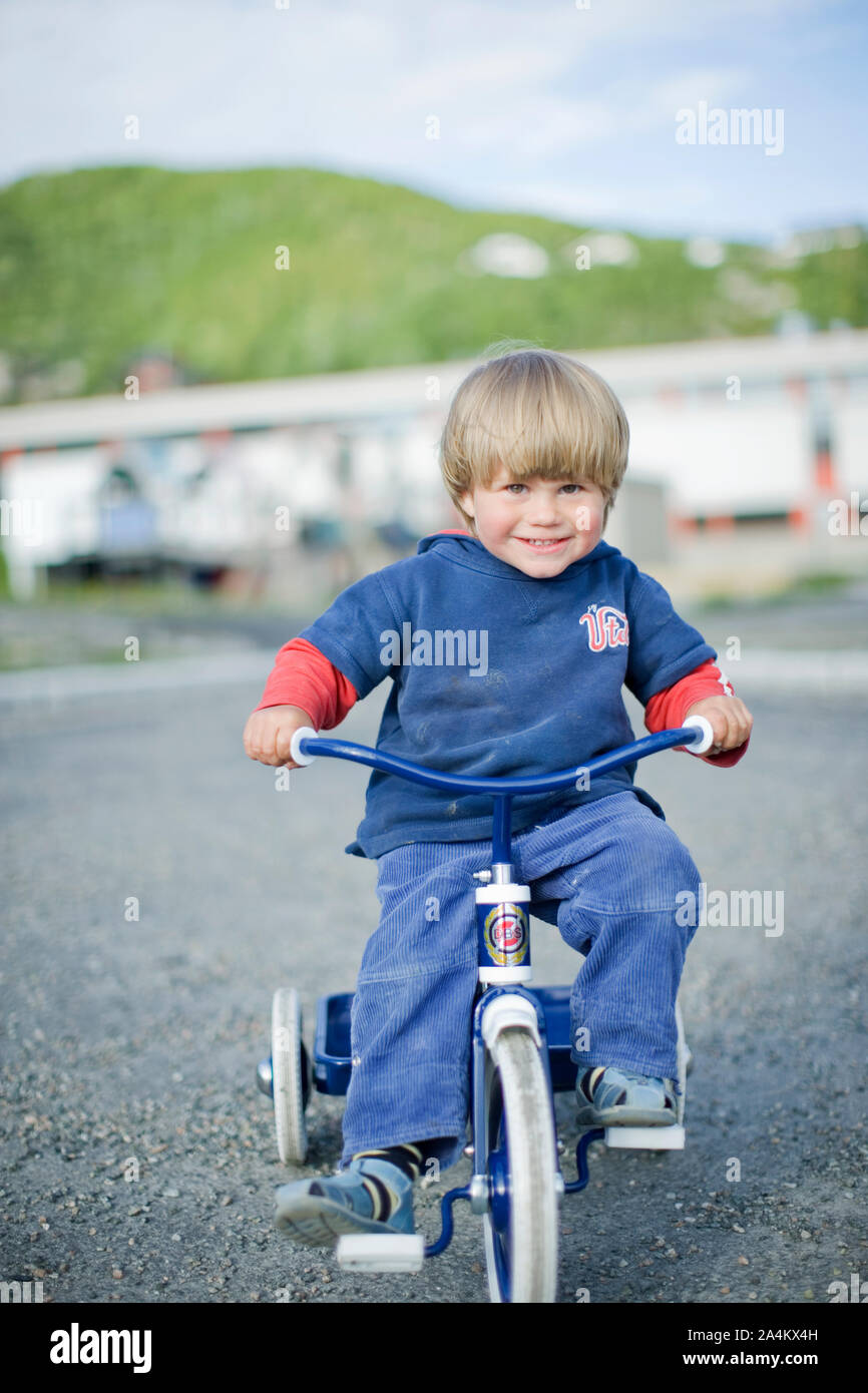 boy on tricycle