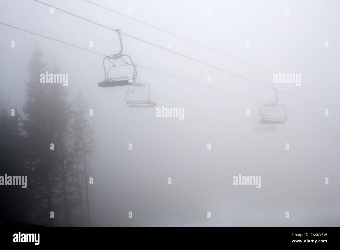 Chair lift above skiing slope Stock Photo Alamy