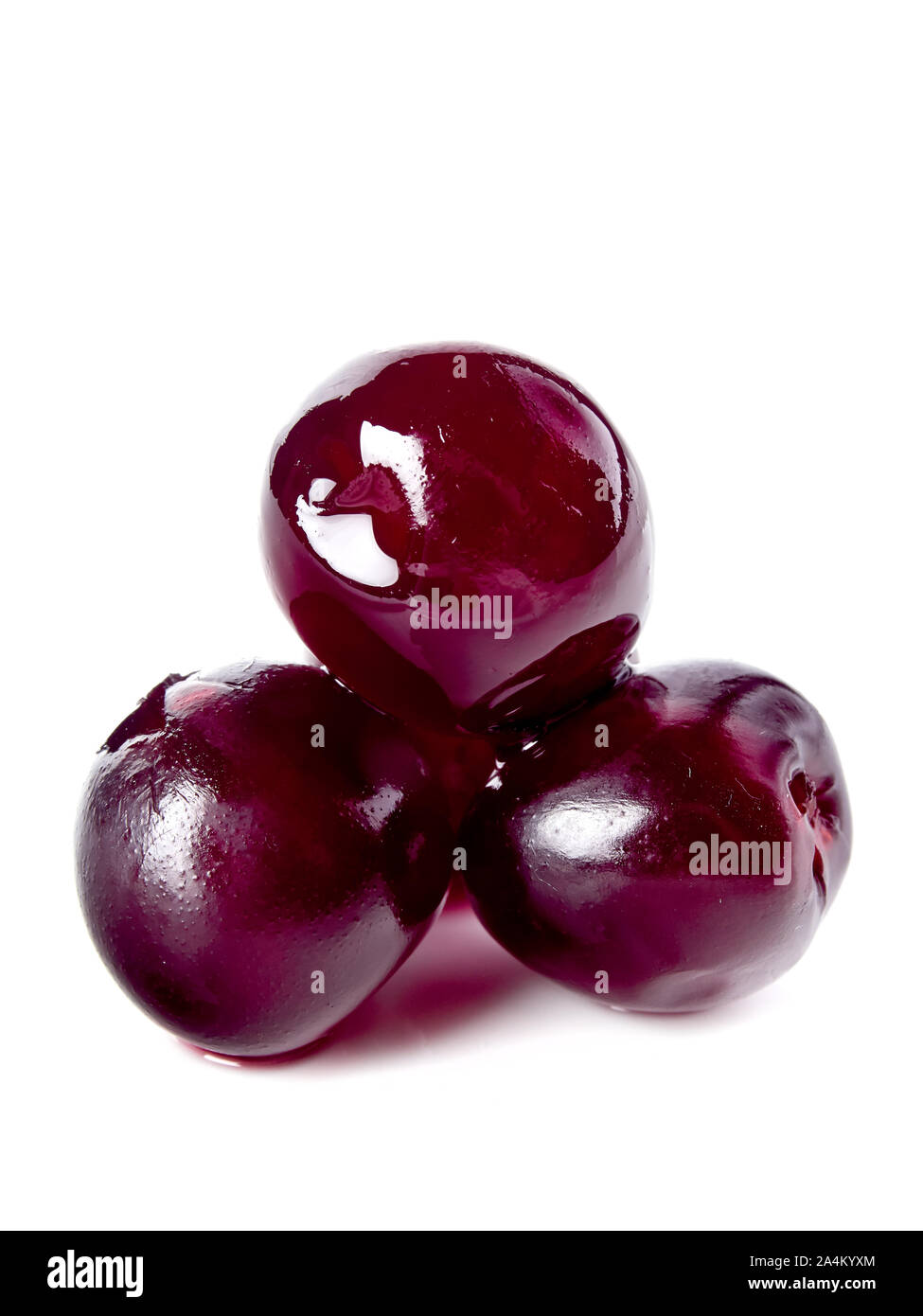 Maraschino cherries for cocktail decoration, isolated on white Stock Photo