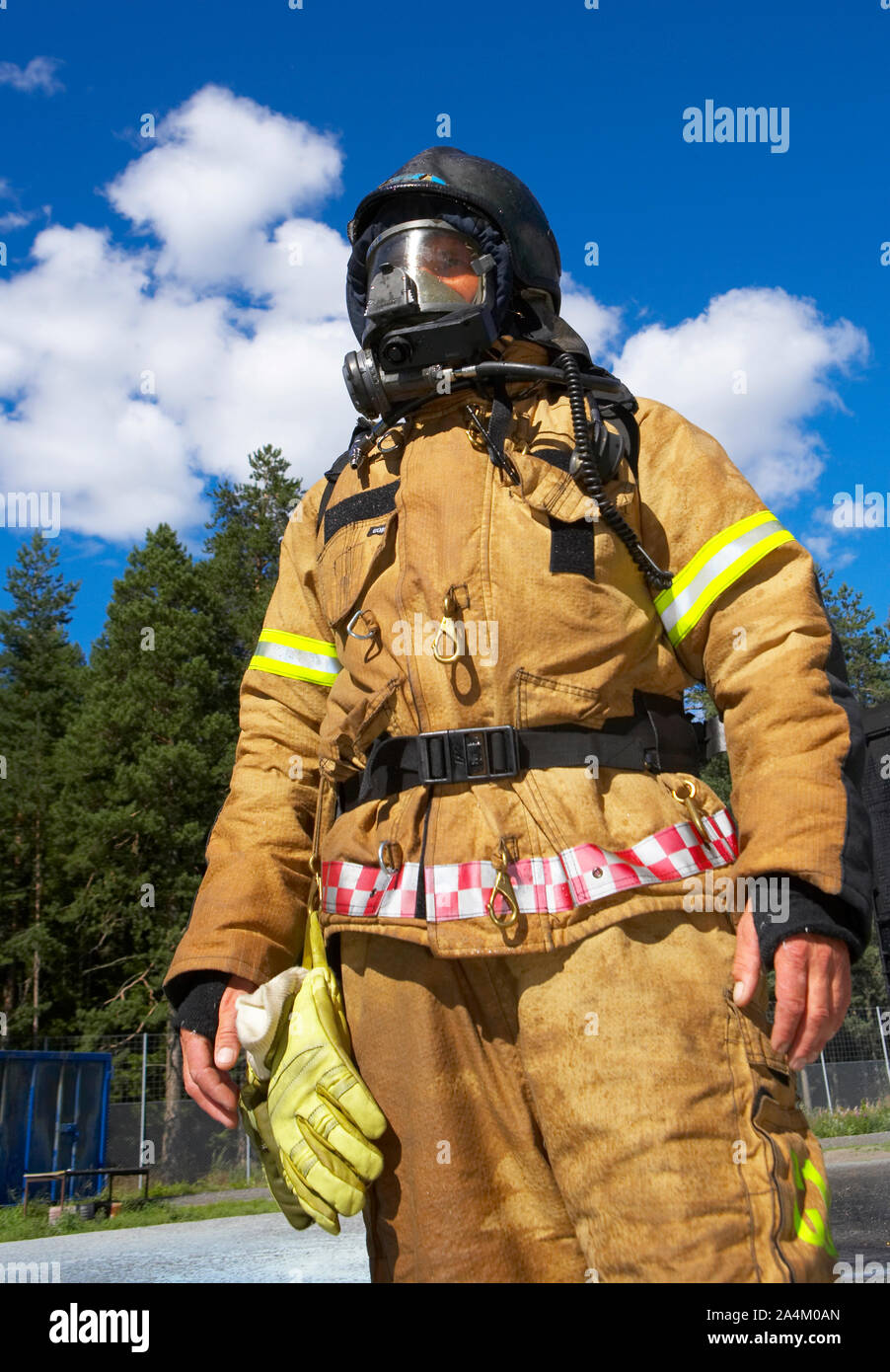 Fireman in his protective clothes Stock Photo - Alamy