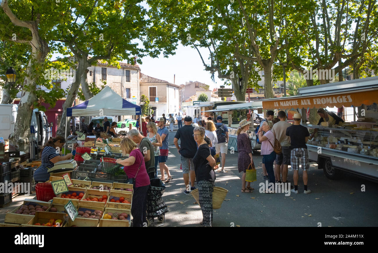Weekly market at St Chinian, Languedoc, fruit, vegetables and cheese stalls. Stock Photo