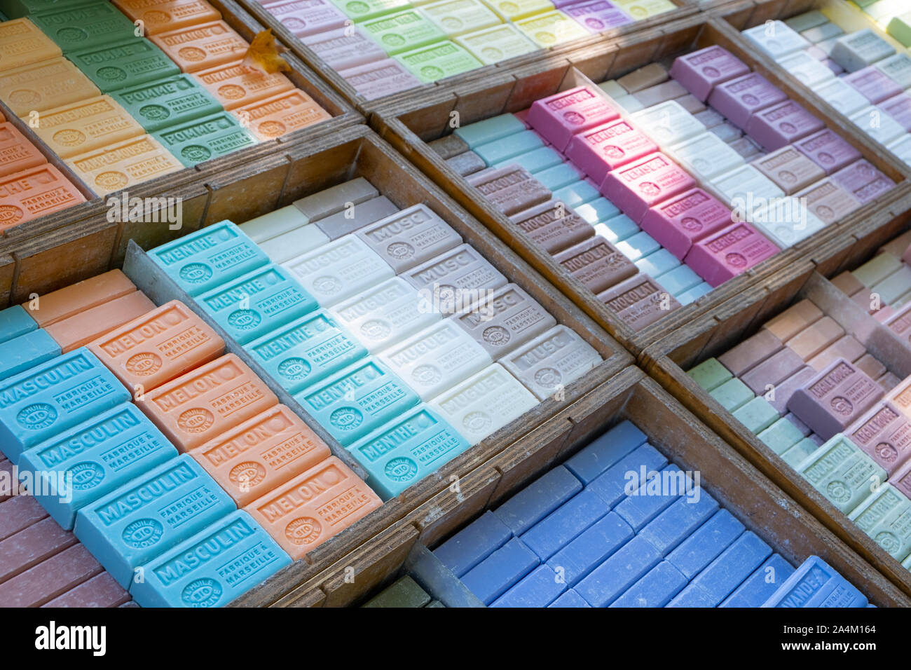 Marseilles soap, the perfumes of france. Many flavours, colours and perfumes in handmade soap made from olive oil, sold on market stalls Stock Photo