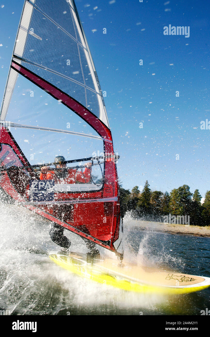 Windsurfing - jumping - seaspray Stock Photo