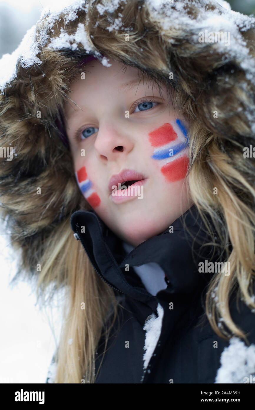 Norwegian Flag Painted On Girl' Face On Cheek Stock Photo
