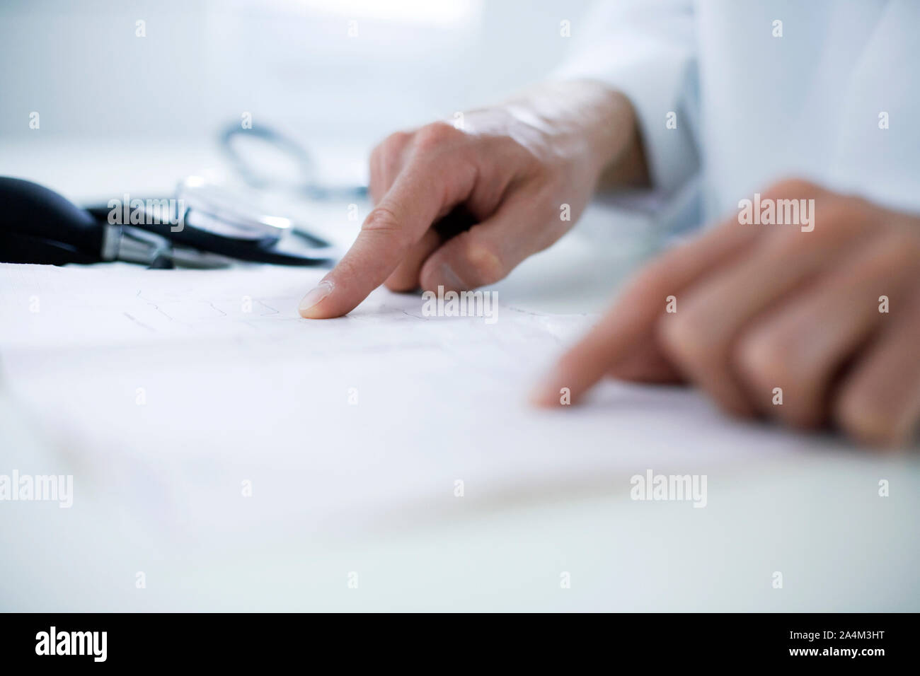 Doctor's office hours explaining Doctor at hospital with ECG chart