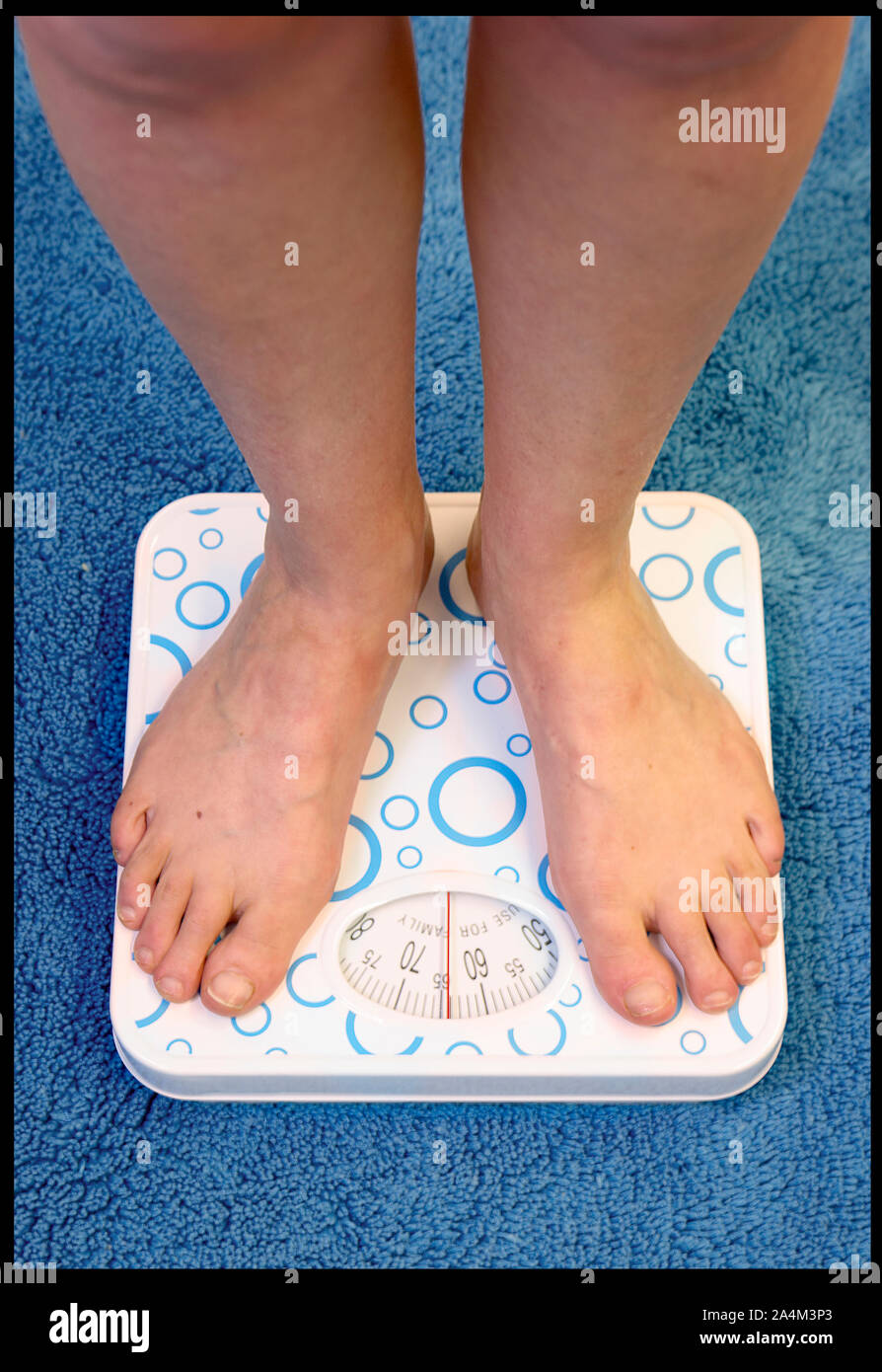 Premium Vector  Normal weight human feet on scales isolated on white.  person with ideal body standing on weighing machine of woman legs, toes  with manicure
