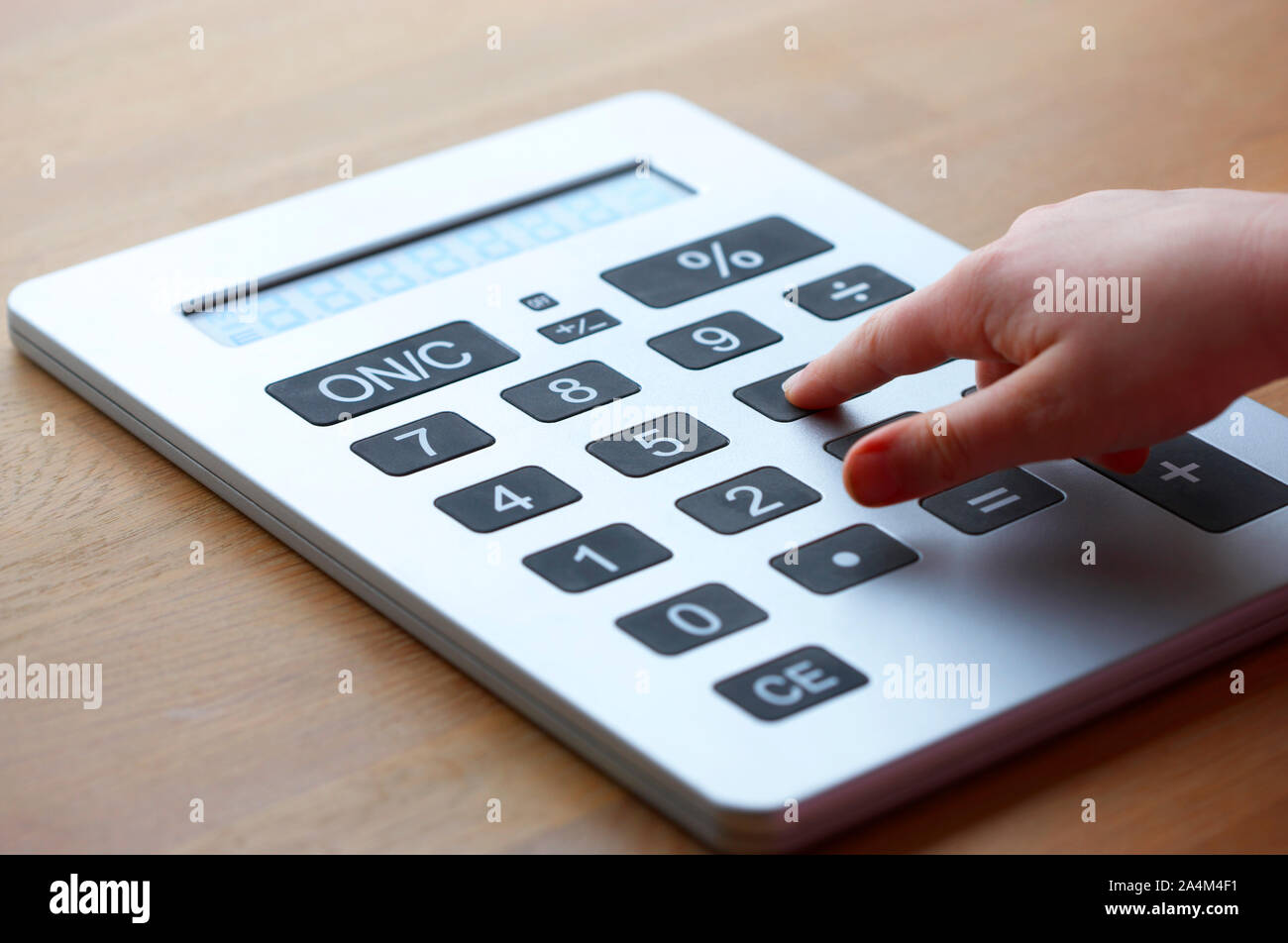 Using a calculator Stock Photo - Alamy