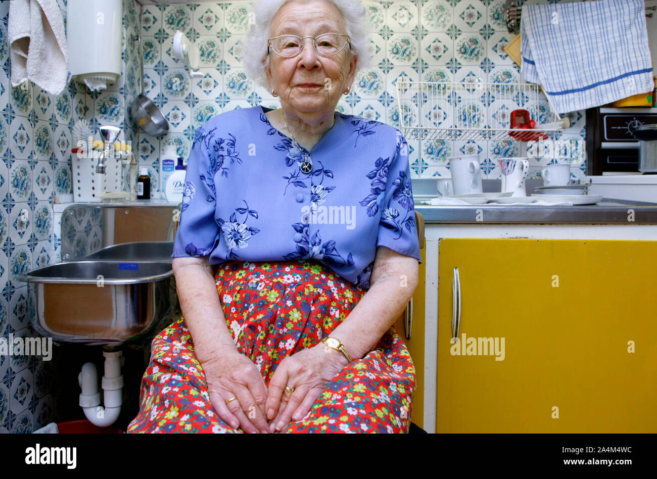 Old Woman in her kitchen Stock Photo - Alamy
