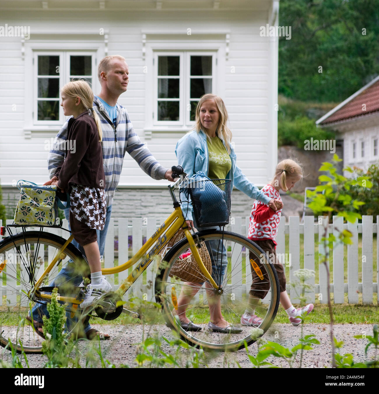 Family strolling with bike, Mandal, Norway Stock Photo