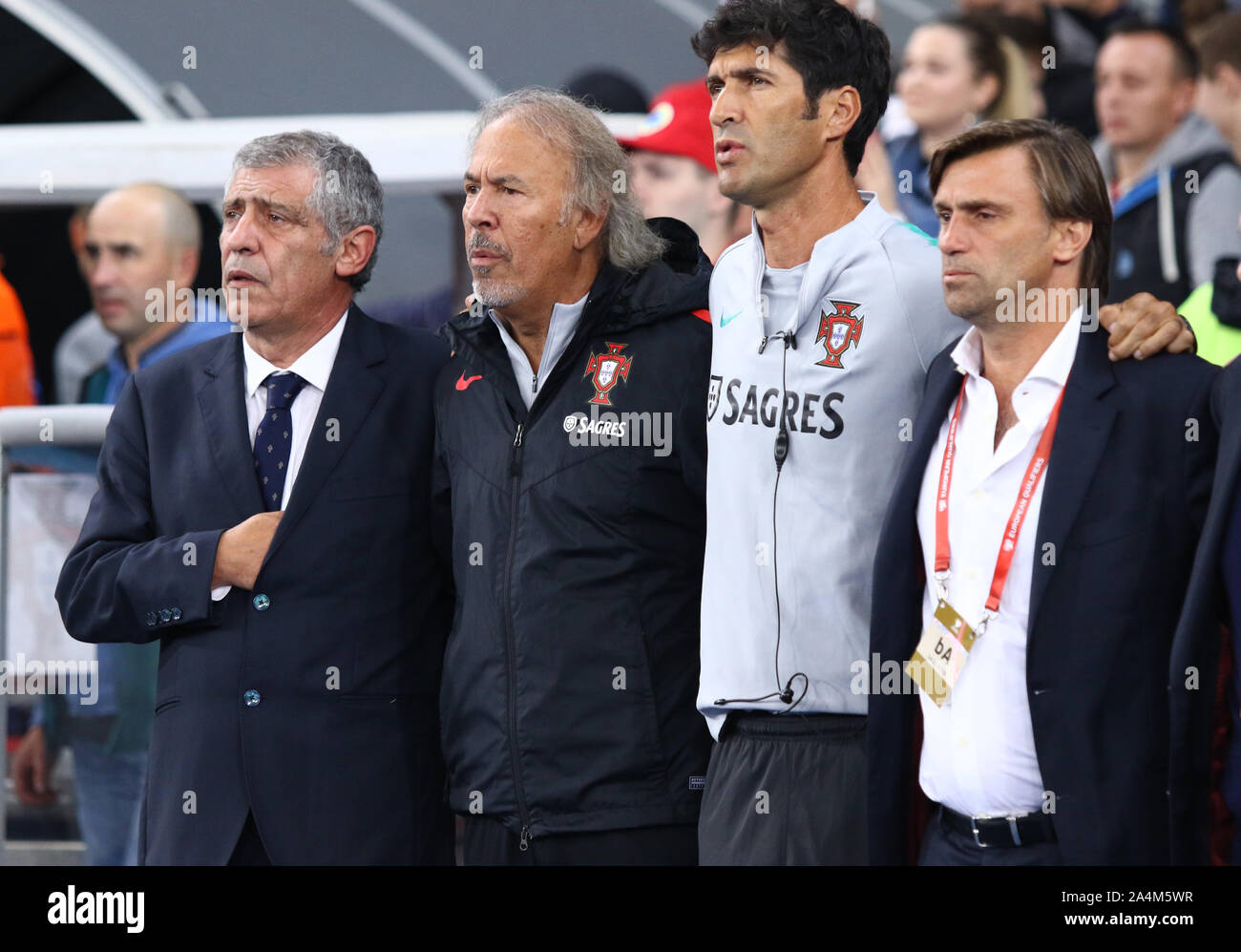 Kyiv, Ukraine - October 14, 2019: Portuguese manager Fernando Santos (L) and his assistants listen to the National Anthem before the UEFA EURO 2020 Qualifying game Ukraine v Portugal in Kyiv, Ukraine Stock Photo