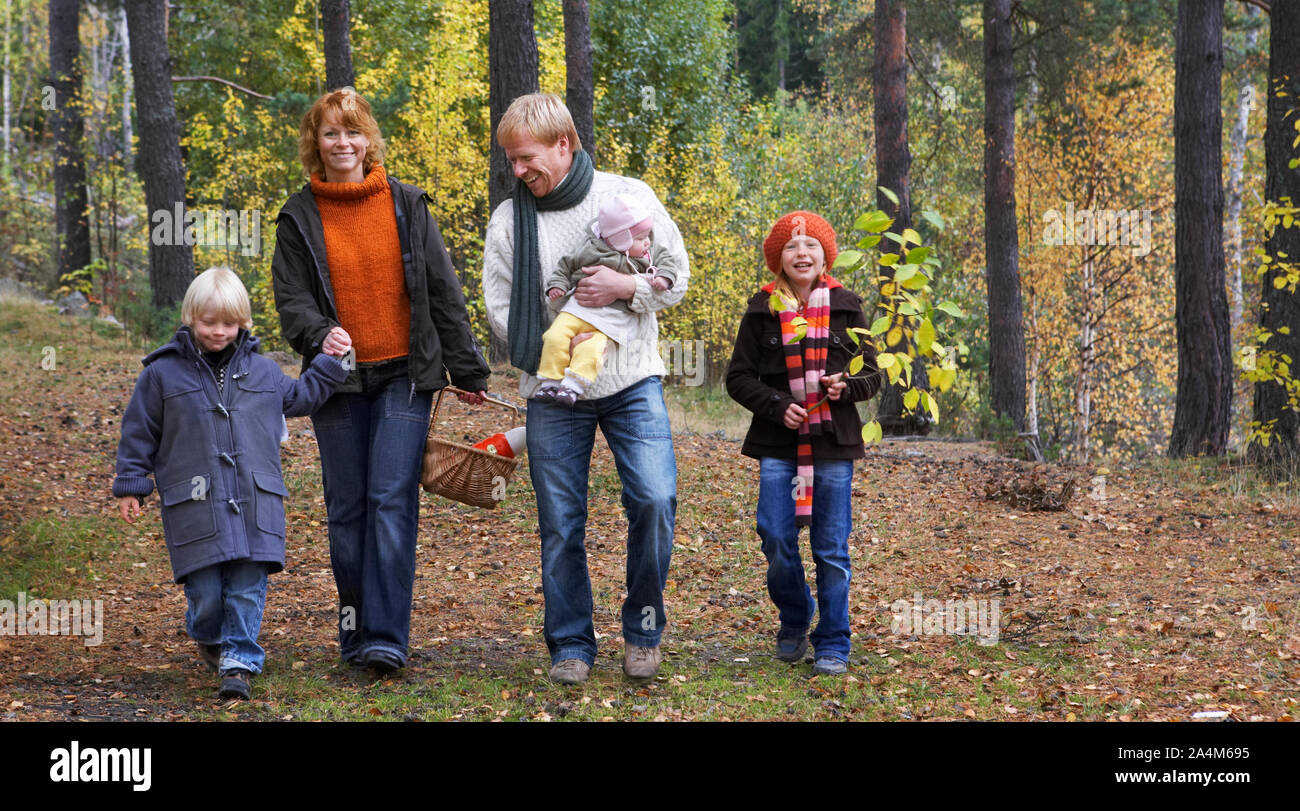 Family with baby in forest Stock Photo