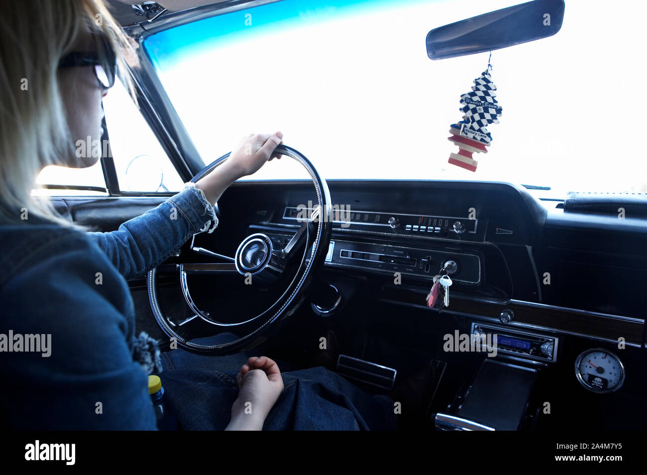 Young woman driving old car Stock Photo - Alamy