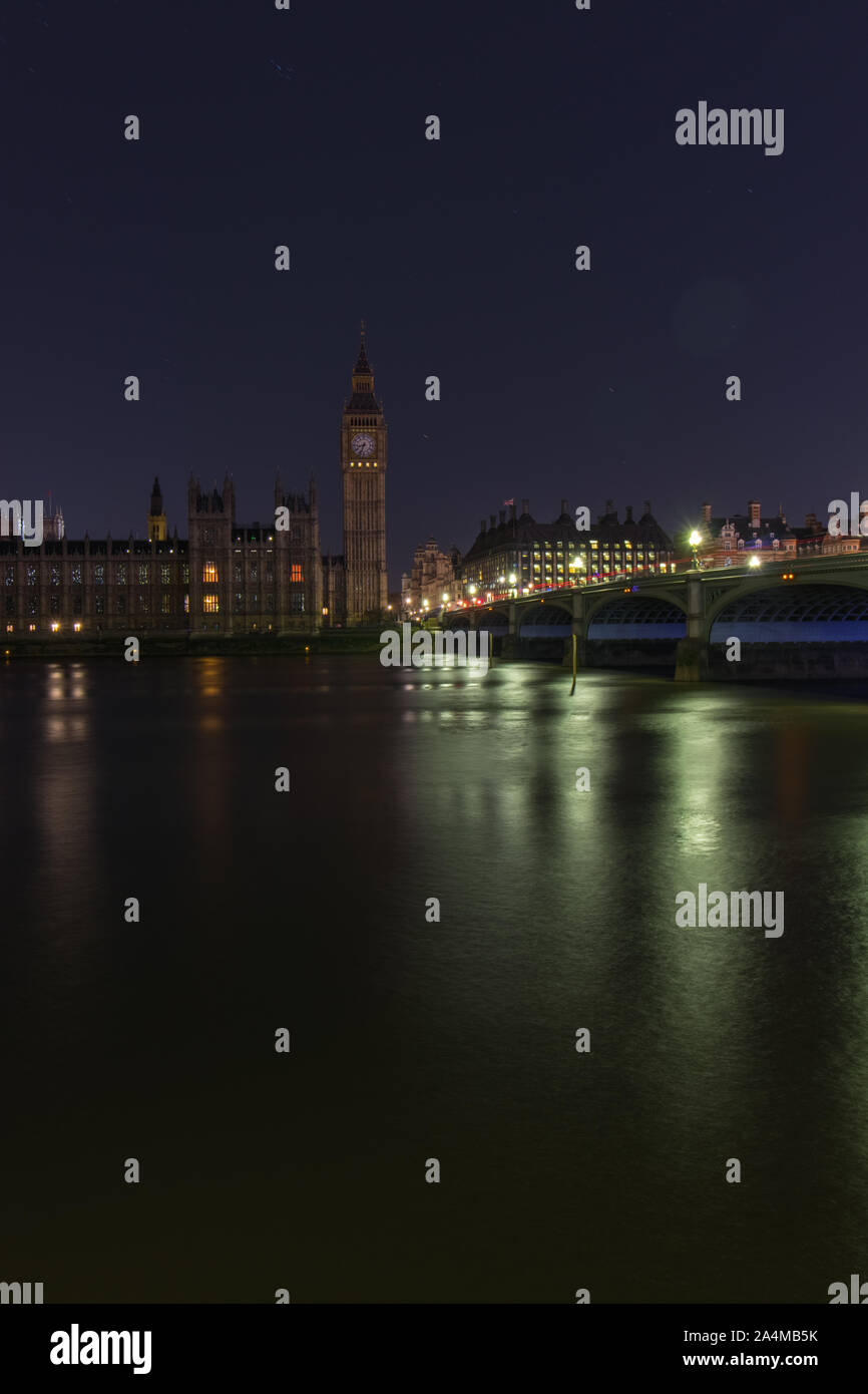 London / United Kingdom - March 25th 2017 - Long exposure of river thames and traffic passing over Westminster Bridge. Westminster lights turned off f Stock Photo