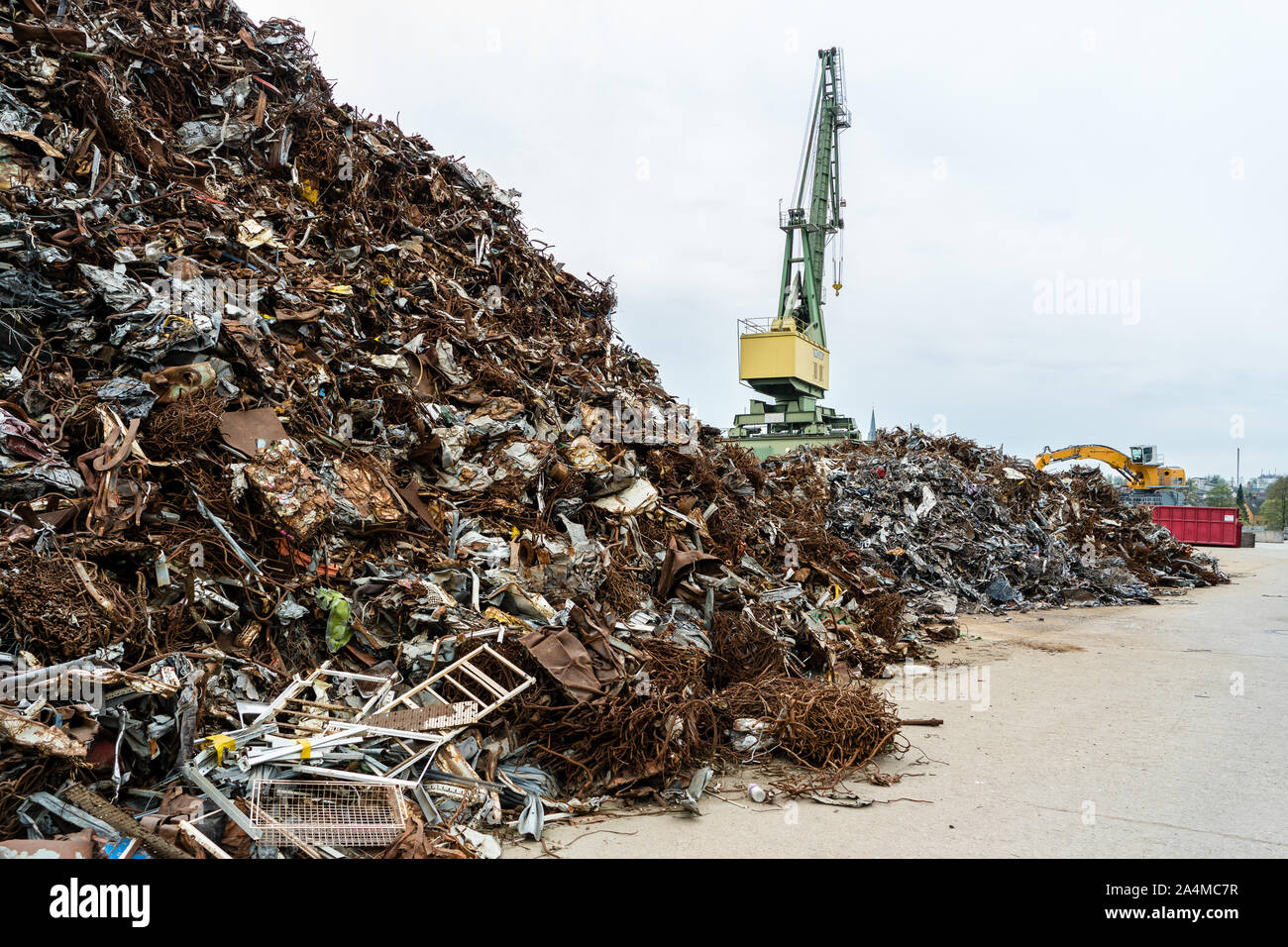 Industrial claw machine, move scrap metal in the landfill Stock Photo