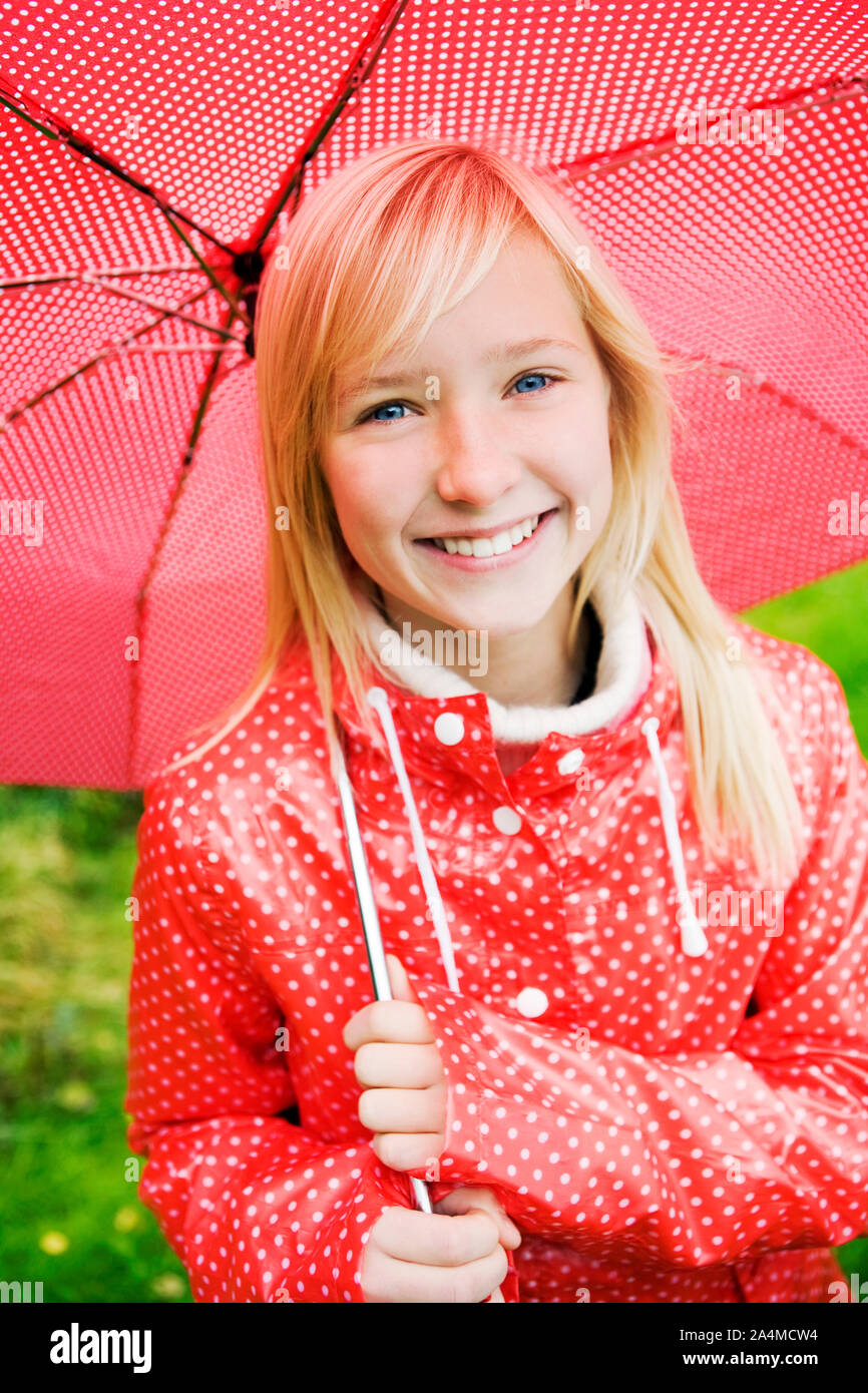 Girl with red umbrella Stock Photo