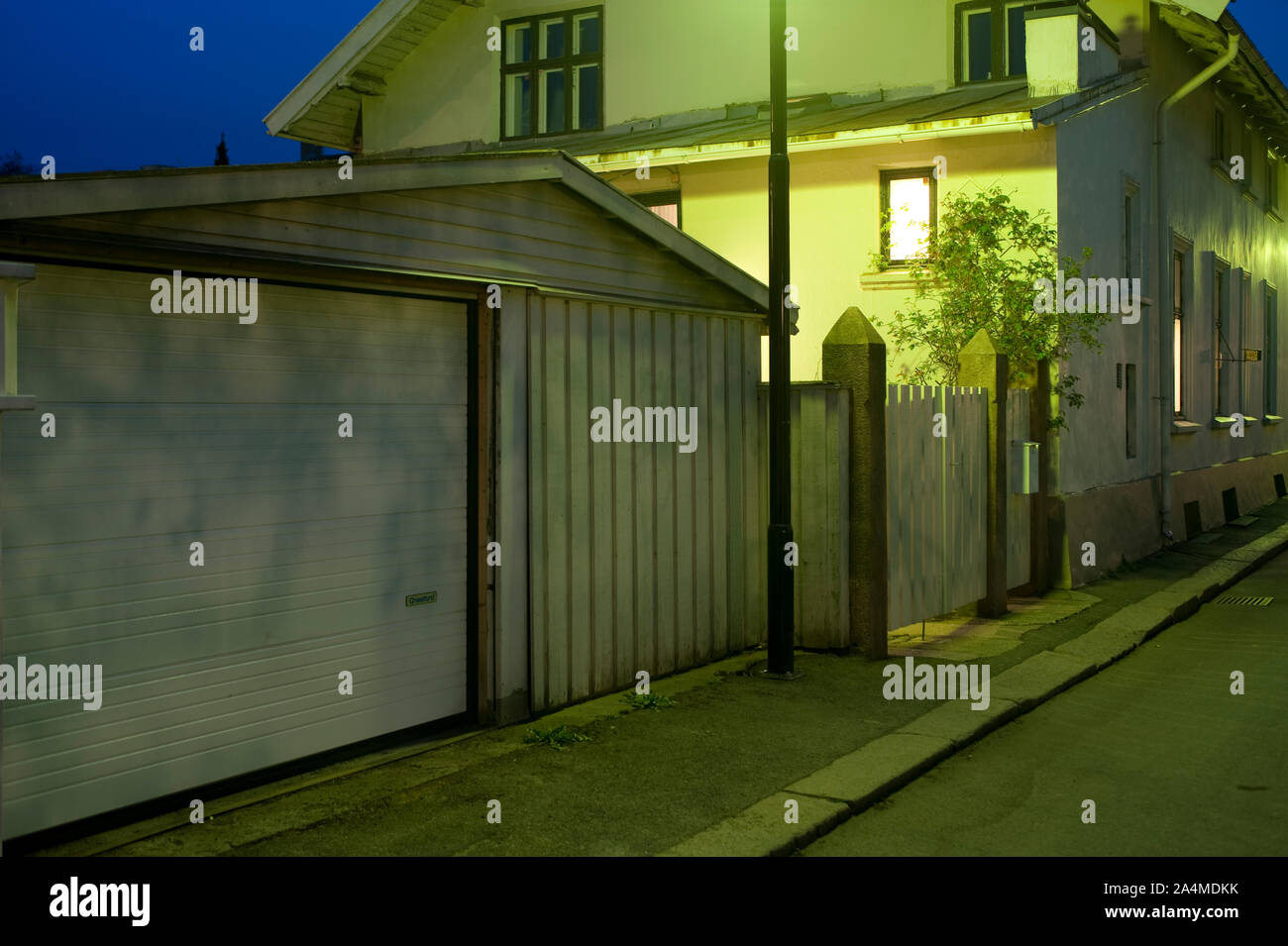 Old concrete house at dusk Stock Photo