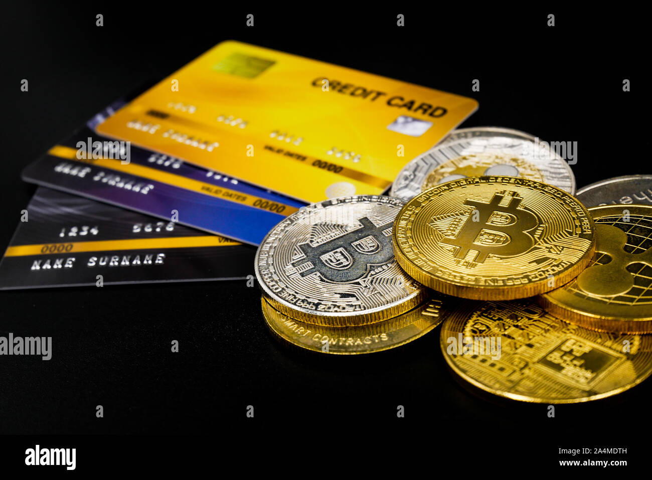 physical version of bitcoin and leather wallet and credit card that is a  new virtual money world cryptocurrency and digital payment system by using  b Stock Photo - Alamy