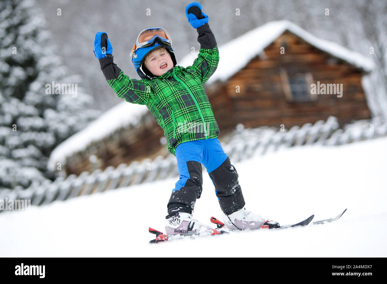 Portrait of child skiing in snow Stock Photo