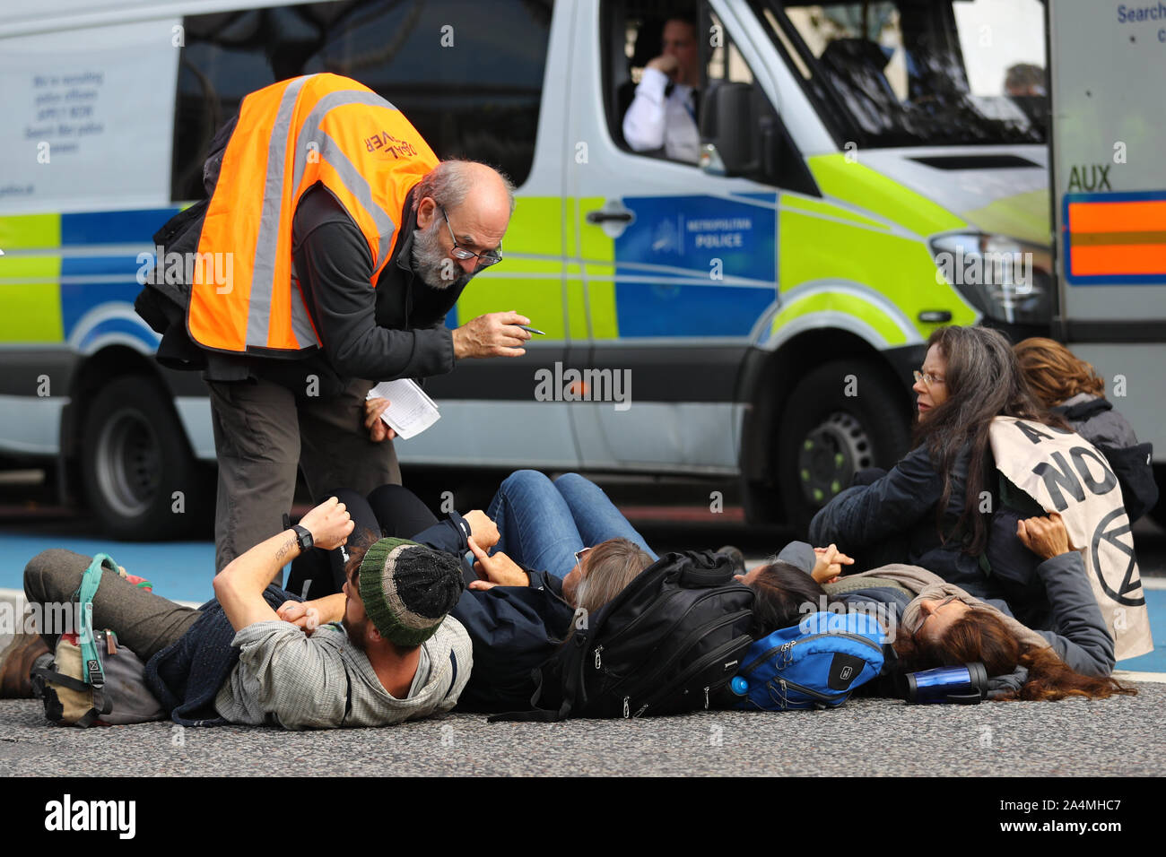 Extinction Rebellion protesters outside MI5 Headquarters on Millbank in London. Stock Photo
