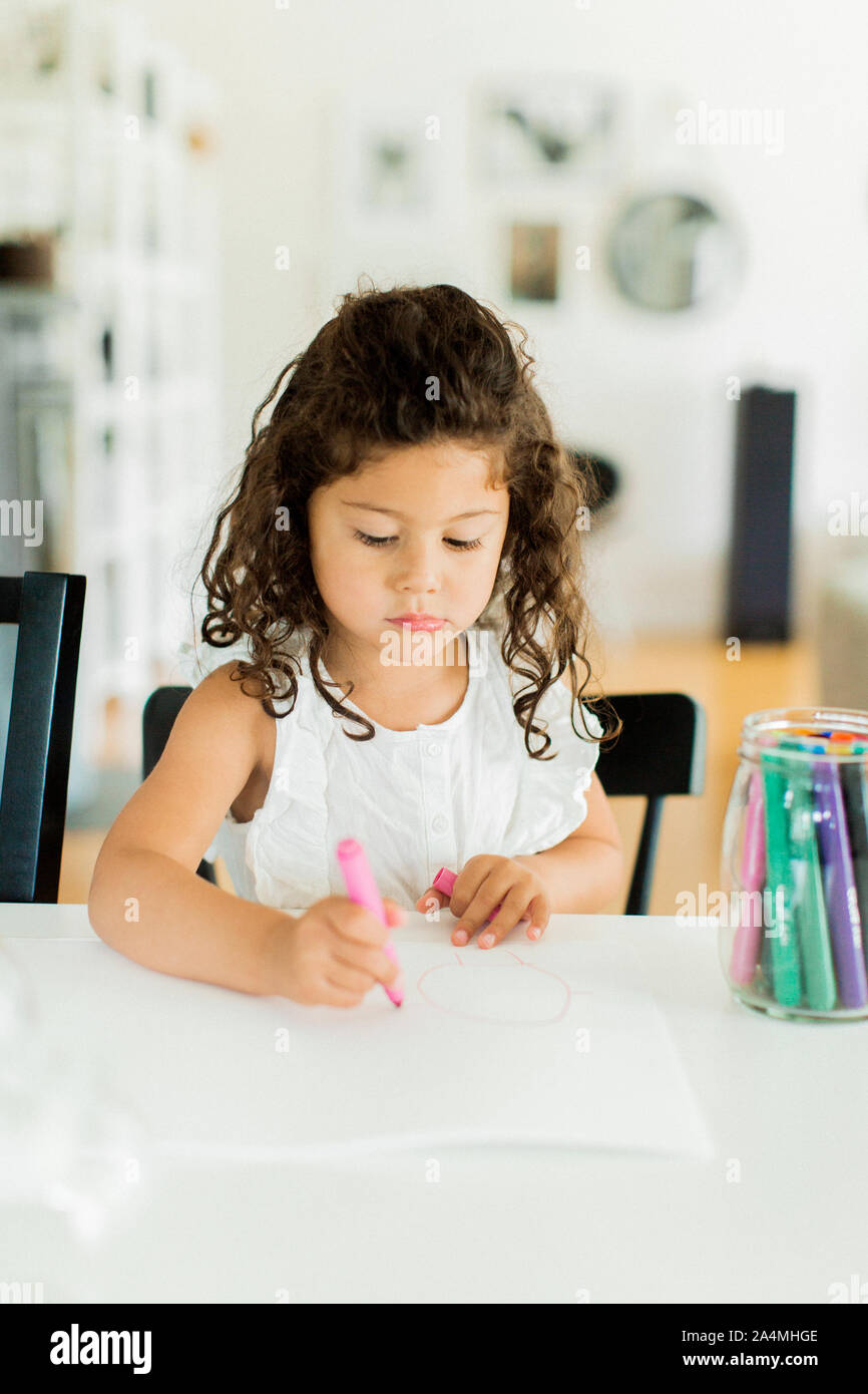 Girl drawing at home Stock Photo