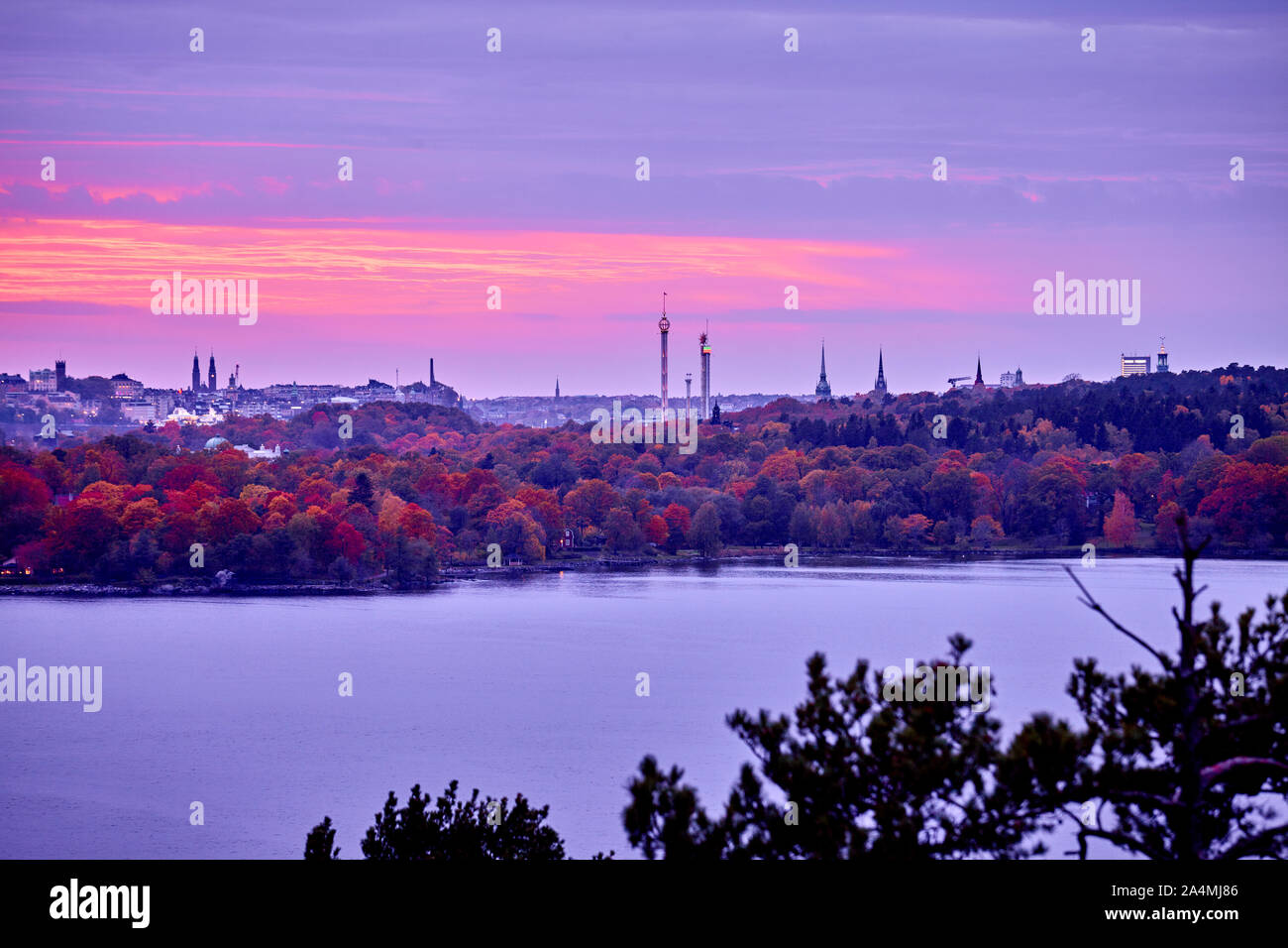 Sunset above city Stock Photo - Alamy