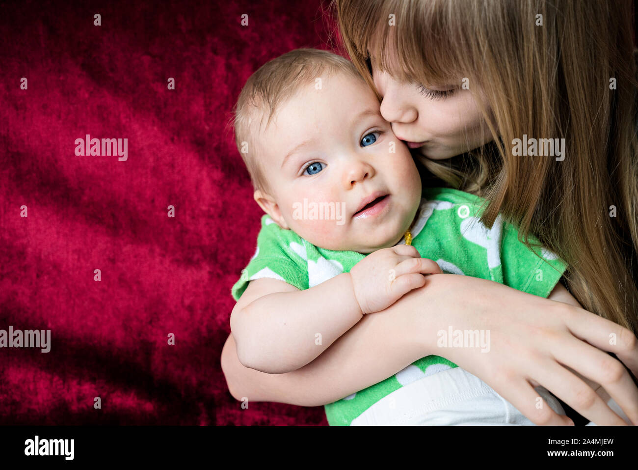 Girl with baby sister Stock Photo Alamy
