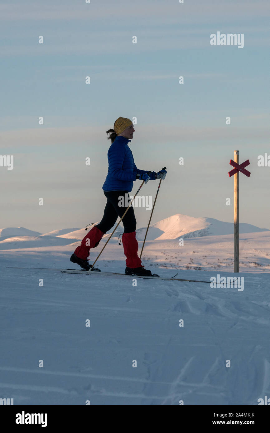 Woman cross country skiing Stock Photo