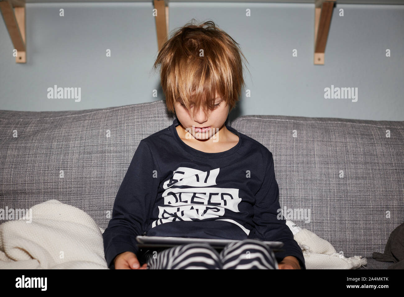 Boy using digital tablet Stock Photo