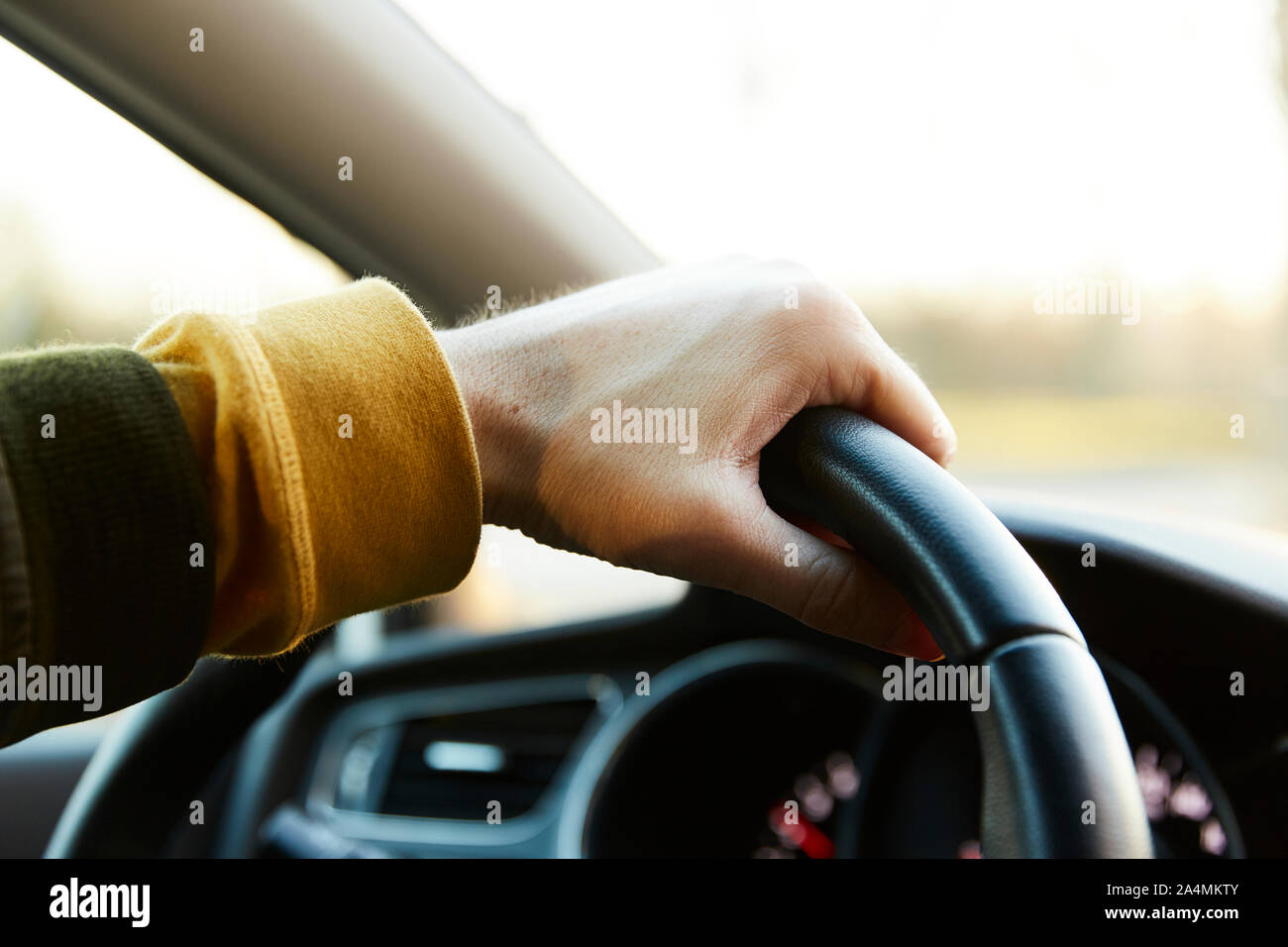 Hand on steering wheel Stock Photo Alamy
