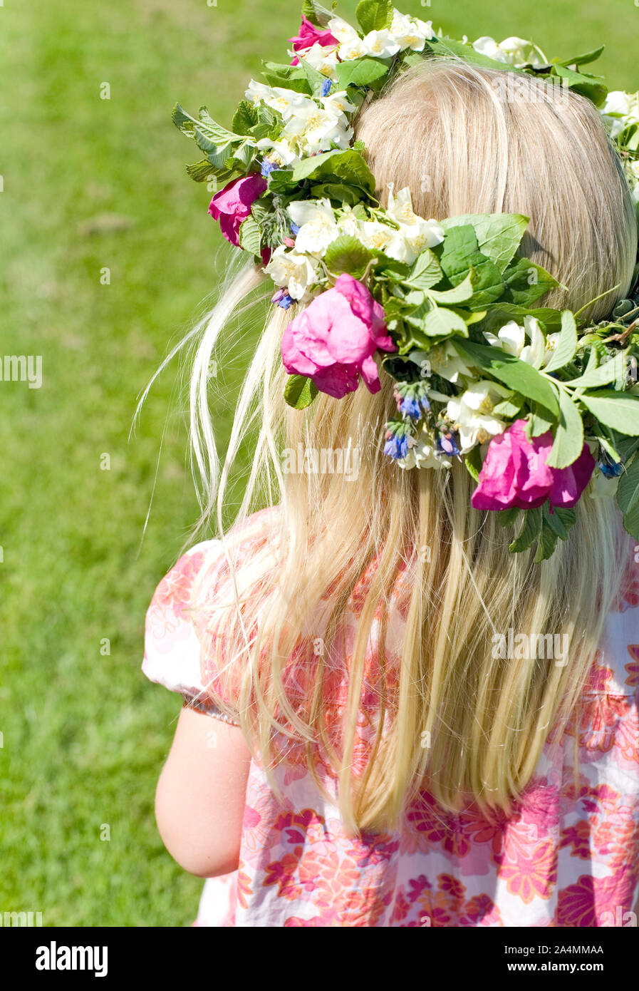 Girl wearing flower wreath Stock Photo - Alamy