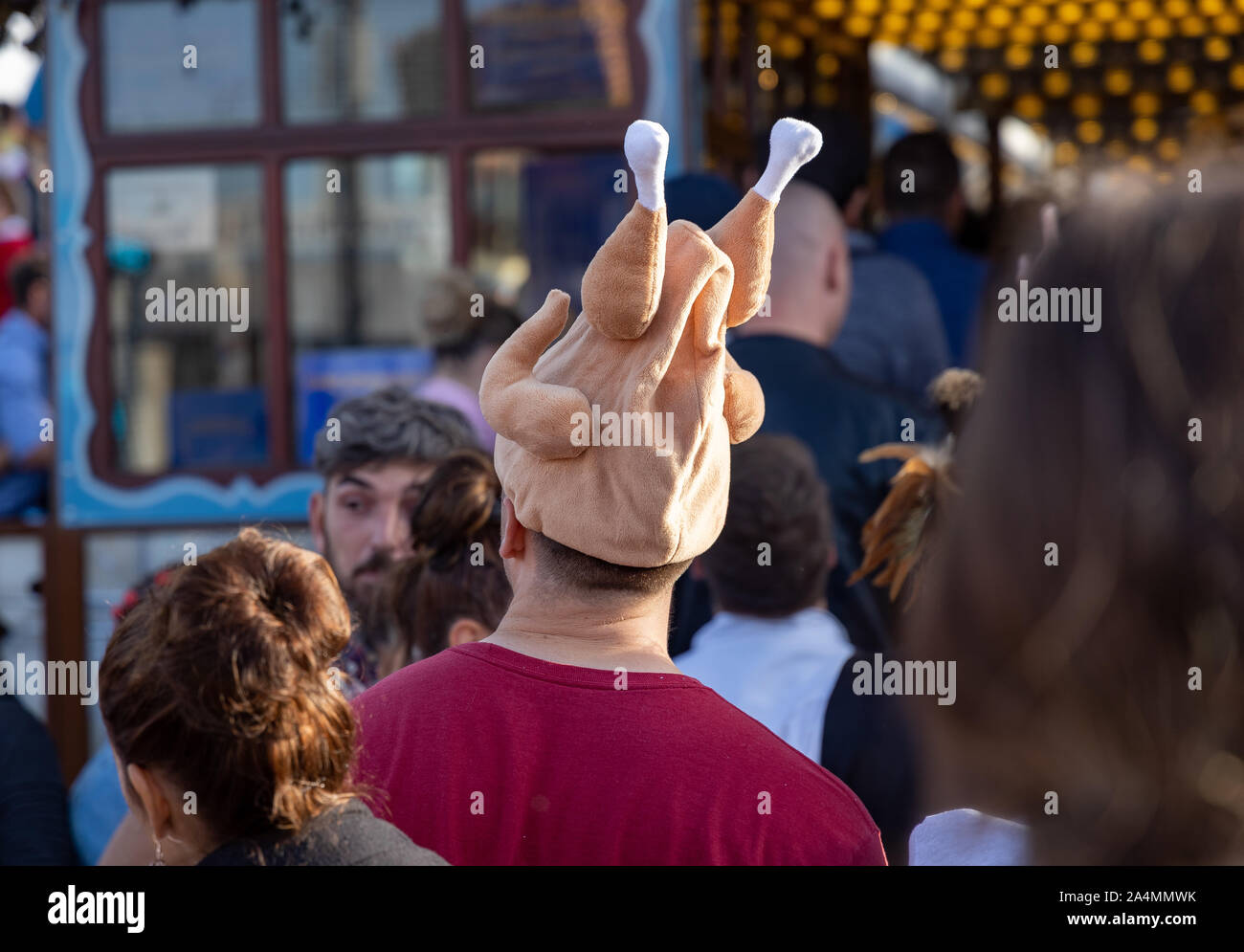 Munich, Germany - 2019 September 28: male with a chicken hat on the oktoberfest in munich Stock Photo