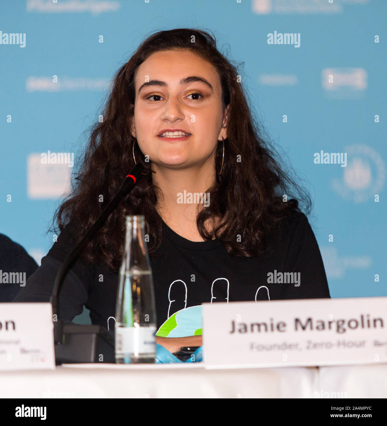 COPENHAGEN, DENMARK – OCTOBER 09, 2019: Jamie Margolin of Seattle, USA, and founder of the Zero-Hours movement speaks during the C40 World Mayors Summit opening press conference at Copenhagen City Hall. More than 90 mayors of some of the world’s largest and most influential cities representing some 700 million people meet in Copenhagen from October 9-12 for the C40 World Mayors Summit. The purpose with the summit in Copenhagen is to build a global coalition of leading cities, businesses and citizens that rallies around radical and ambitious climate action. Also youth leaders from the recent Cl Stock Photo