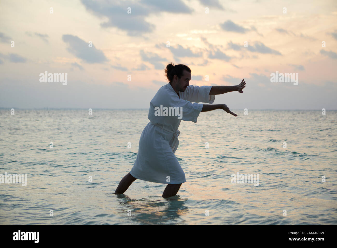 Man doing yoga Stock Photo