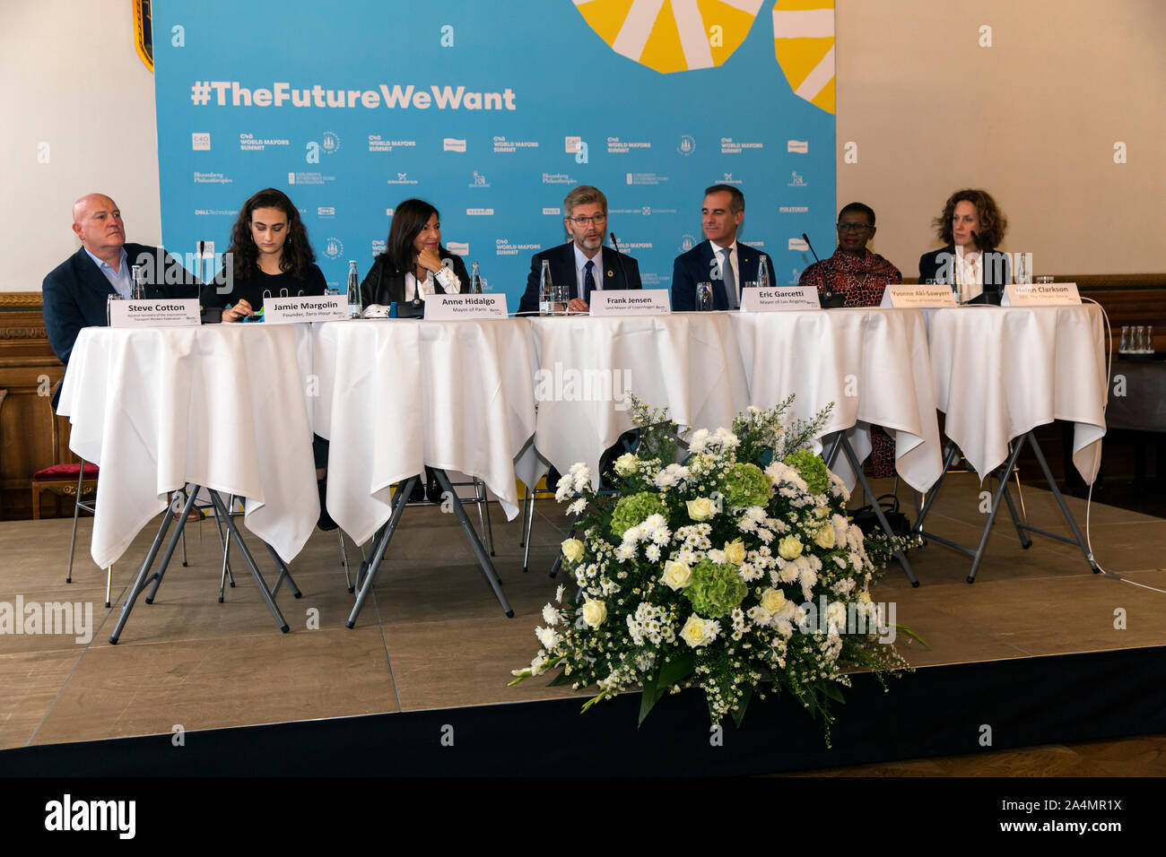 COPENHAGEN, DENMARK – OCTOBER 09, 2019:  Participants at the C40 World Mayors Summit opening press conference at Copenhagen City Hall.  From L – R appears: Steve Cotton (General Secretary of the International Transport Workers Federation),  Jamie Margolin ( activist and founder of the Zero-Hour movement) , Anne Hidalgo (Mayor of Paris), Frank Jensen (Lord Mayor of Copenhagen), Eric Garcetti (Mayor of Los Angeles),  Yvonne Aki-Sawyerr (Mayor of Freetown, Sierre Leone) and Helen Clarkson (Founder of The Climate Group).  During the press conference the new C40 chair, Eric Garsetti, Mayor of Los A Stock Photo