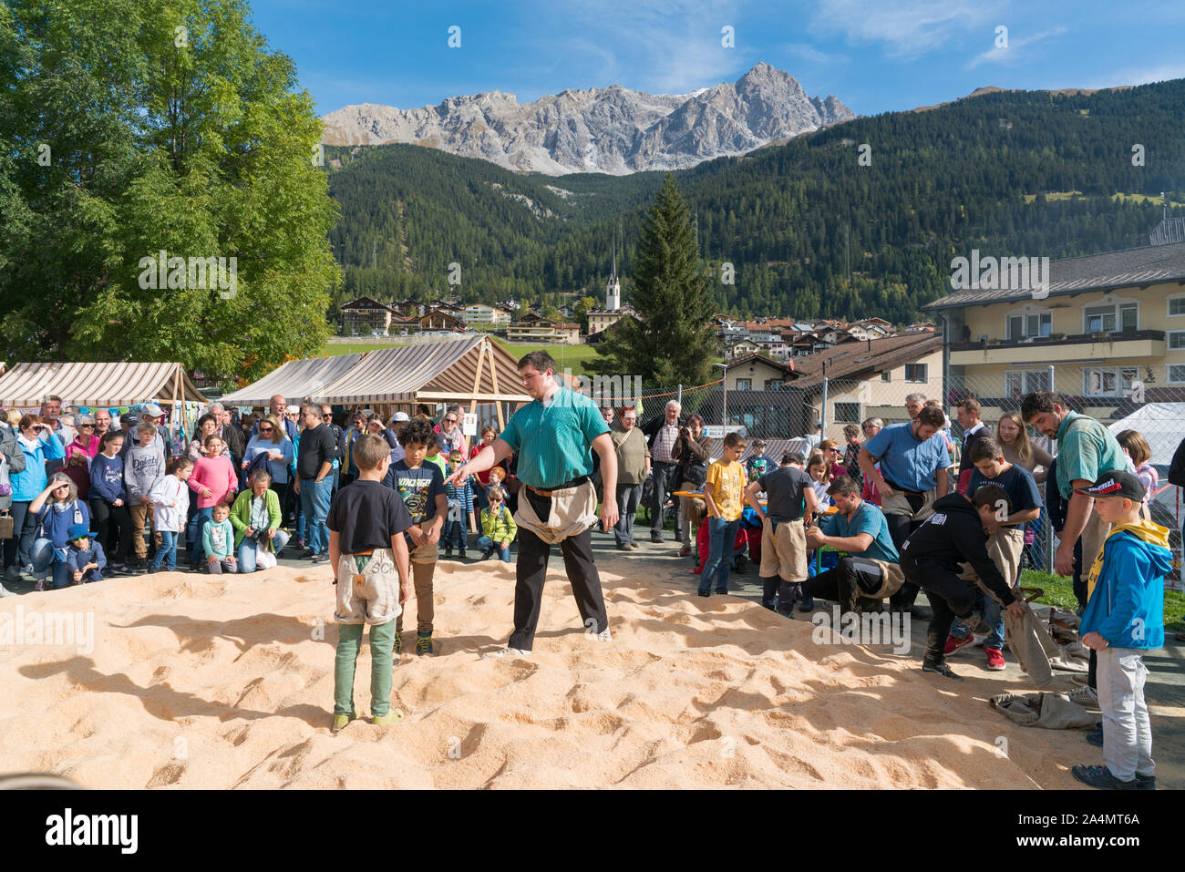 Savognin, GR / Switzerland, - 12 October, 2019: children being instructed on the rules of Swiss wrestling during a workshop Stock Photo