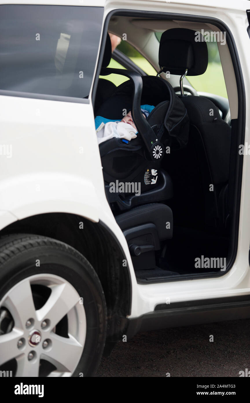 Baby sleeping in car Stock Photo