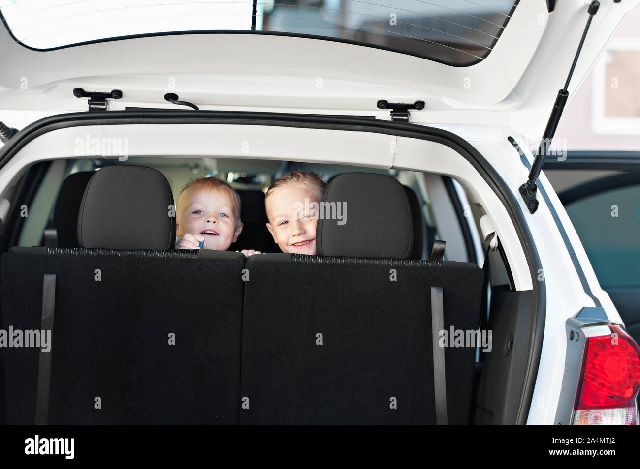 Smiling boy and girl in car Stock Photo