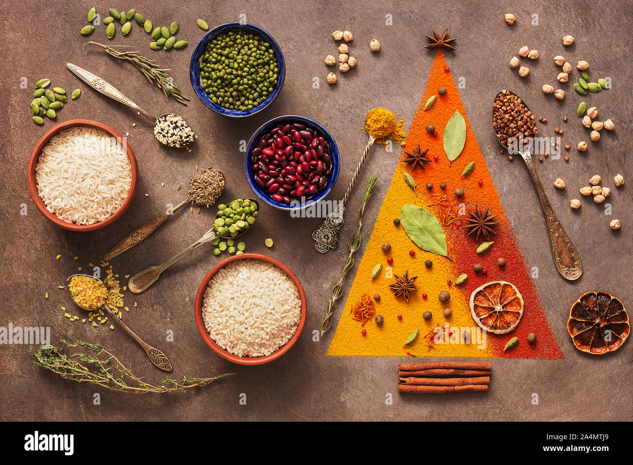A Variety Of Spices Cereals Beans Seeds On A Dark Background Abstract Christmas Tree Top View Stock Photo Alamy